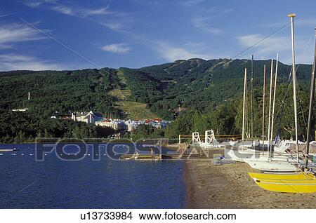 Canada, Quebec, Laurentians, Mount Tremblant, Sailboats on the beach along Lac Tremblant in the Laurentian Mountains. View Large Photo Image Picture - Canada, Quebec, Laurentians, Mount Tremblant, Sailboats on the beach along Lac Tremblant in the Laurentian Mountains.. Fotosearch