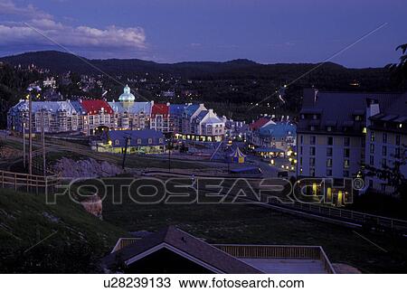 Canada, Quebec, Laurentians, Mount Tremblant, Scenic view of the Tremblant Resort in the evening in the Laurentian Mountains. View Large Photo Image Stock Image - Canada, Quebec, Laurentians, Mount Tremblant, Scenic view of the Tremblant Resort in the evening in the Laurentian Mountains.. Fotosearch