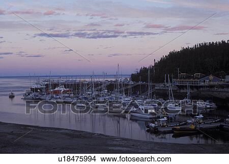 Canada, Tadoussac, Quebec, Marina on the St. Lawrence (Fleuve Saint-Laurent) and Saguenay Rivers at sunset in the summer resort town of Tadoussac. View Large Photo Image Picture - Canada, Tadoussac, Quebec, Marina on the St. Lawrence (Fleuve Saint-Laurent) and Saguenay Rivers at sunset in the summer resort town of Tadoussac.. Fotosearch