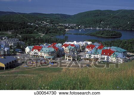 Stock Image -  Canada, Tremblant Resort, Quebec, Laurentians, Mount Tremblant, Scenic view of the Tremblant Resort in the Laurentian Mountains and Lac Tremblant.. Fotosearch
