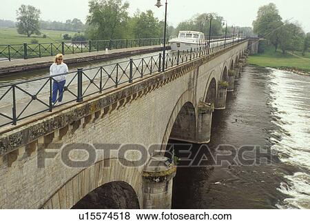 canal, bridge, Digoin, France, Burgundy, Saone-et-Loire, Bourgogne, Loire River, Europe, wine region, A boat crosses the Canal Du Centre (canal bridge) which spans the Loire River in the town of Digoin. View Large Photo Image Stock Photo - canal, bridge, Digoin, France, Burgundy, Saone-et-Loire, Bourgogne, Loire River, Europe, wine region, A boat crosses the Canal Du Centre (canal bridge) which spans the Loire River in the town of Digoin.. Fotosearch