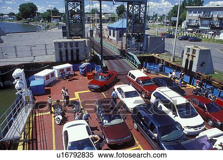 Stock Photography -  car ferry, St. Ignace-de-Loyola, Canada, Quebec, Sorrel-St. Ignace-de-Loyola car ferry crosses the St. Lawrence River (Fleuve Saint-Laurent) from the ferry terminal at St. Ignace-de-Loyola.. Fotosearch