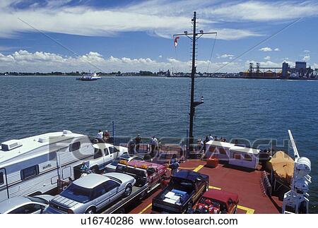 Stock Photograph -  car ferry, St. Lawrence River, Canada, Quebec, Sorrel-St. Ignace-de-Loyola car ferry crosses the St. Lawrence River (Fleuve Saint-Laurent). . Fotosearch