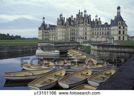 Chambord, France, Loire-et-Cher, Centre, Loire Castle Region, Europe, Loire Valley, Rowboats tied to dock at the 16th century Chateau de Chambord in the Loire Castle Region. View Large Photo Image Stock Photograph - Chambord, France, Loire-et-Cher, Centre, Loire Castle Region, Europe, Loire Valley, Rowboats tied to dock at the 16th century Chateau de Chambord in the Loire Castle Region.. Fotosearch