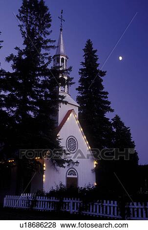 Stock Photo -  chapel, church, Canada, Quebec, Laurentians, Mount Tremblant, Moonrise above Chapelle St. Bernard in Mount Tremblant in the evening.. Fotosearch