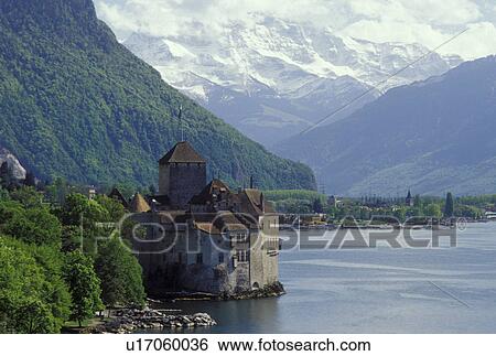 Stock Photograph -  Chillon castle, Montreux, Switzerland, Vaud, Alps, Lake Geneva, Europe, Picturesque view of the Chateau de Chillon a 13th century fortress and the Alps along the lakeshore of Lac Leman in the spring in the Canton of Vaud. . Fotosearch