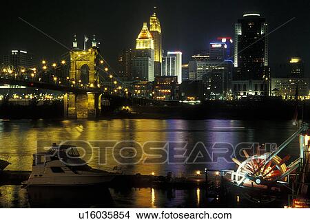 Picture -  Cincinnati, OH, Ohio, Downtown skyline along the Ohio River, evening. Fotosearch
