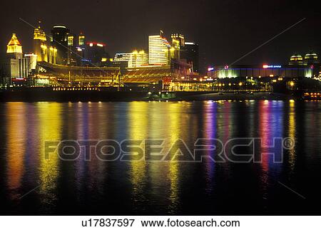 Stock Photo -  Cincinnati, OH, Ohio, Downtown skyline along the Ohio River, evening. Fotosearch