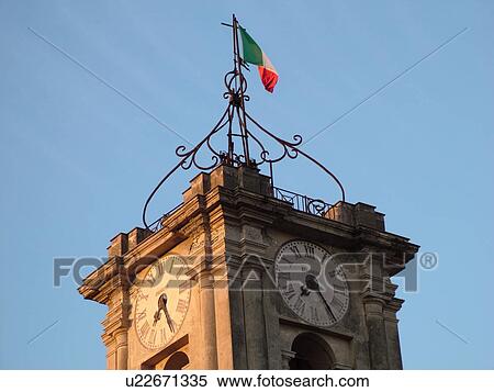 Stock Photography -  clock tower, Italy, Lazio, Tarquinia, Europe, Clock tower on top of City Hall in the village of Tarquinia.. Fotosearch