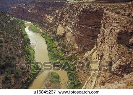 Stock Photo -  CO, Colorado, Uncompahgre National Forest, Dolores River, Unaweep-Tabeguache Scenic Byway, Hanging Flume, a wooden trough built on the side of the canyon wall.. Fotosearch