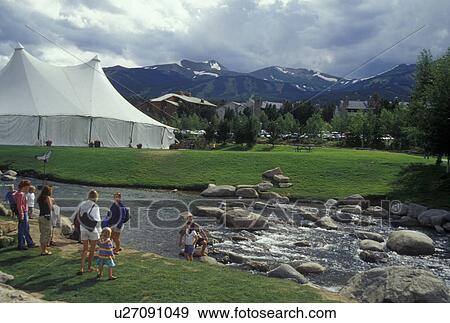Stock Photo -  Colorado, CO, Breckenridge, People wading in Blue River, resort town. Fotosearch