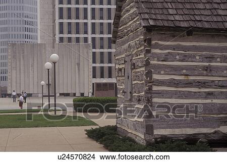 Picture -  Dallas, TX, Texas, downtown, John Neely Bryan Cabin & John Fitzgerald Kennedy Memorial. Fotosearch