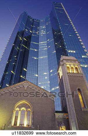 Stock Photo -  Denver, CO, Colorado, downtown, Trinity United Methodist Church, high-rise building, evening. Fotosearch