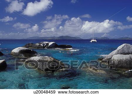 Stock Photo -  Devils Bay National Park, Virgin Gorda, BVI, British Virgin Islands, The Baths, Caribbean, People snorkeling along the rocky coastline of Devils Bay Nat'l Park at The Baths on Virgin Gorda on the Caribbean Sea.. Fotosearch