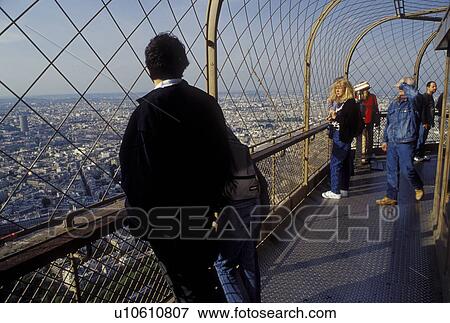 Eiffel Tower, Paris, Ile de France, France, Europe, People at the top observation platform of the Eiffel Tower overlooking the city of Paris. View Large Photo Image Stock Photo - Eiffel Tower, Paris, Ile de France, France, Europe, People at the top observation platform of the Eiffel Tower overlooking the city of Paris.. Fotosearch