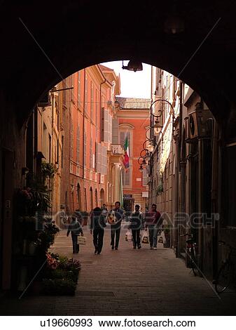 Stock Image -  Emilia-Romagna, Italy, Reggio nell'Emilia, Europe, Narrow street in the town of Reggio Emilia.. Fotosearch