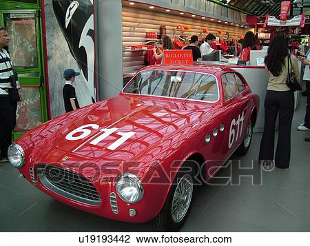Stock Image -  Ferrari, Italy, Maranello, Emilia-Romagna, Europe, Ferrari race car displayed inside the Galleria Ferrari in the town of Maranello.. Fotosearch
