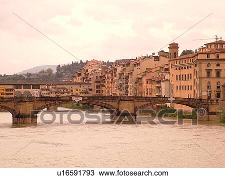 Stock Image -  Florence, Italy, Firenza, Tuscany, Toscana, Europe, Ponte Santa Trinita crosses the River Arno in the city of Florence.. Fotosearch