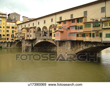 Florence, Italy, Firenza, Tuscany, Toscana, Europe, Ponte Vecchio, a bridge lined with shops, crosses the River Arno in the city of Florence. View Large Photo Image Stock Photo - Florence, Italy, Firenza, Tuscany, Toscana, Europe, Ponte Vecchio, a bridge lined with shops, crosses the River Arno in the city of Florence.. Fotosearch