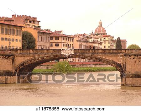 Stock Photo -  Florence, Tuscany, Italy, Firenza, Toscana, Europe, Ponte Santa Trinita crosses the River Arno in the city of Florence.. Fotosearch
