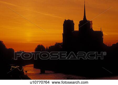 France, Paris, Ile de France, Europe, Silhouette of the Notre Dame Cathedrale at sunset along the Seine River in Paris. View Large Photo Image Picture - France, Paris, Ile de France, Europe, Silhouette of the Notre Dame Cathedrale at sunset along the Seine River in Paris.. Fotosearch