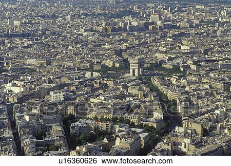 Stock Photograph -  France, Paris, Ile de France, Europe, Aerial view of the city of Paris and the Arc de Triomphe looking North from the Eiffel Tower.. Fotosearch