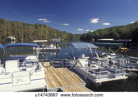 GA, Georgia, Boats docked on Lake Burton in North Georgia in the fall  View Large Photo Image Stock Photo -  GA, Georgia, Boats docked on Lake Burton in North Georgia in the fall . Fotosearch