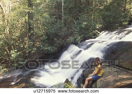 GA, Georgia, Chattahoochee National Forest, Long Creek Falls, North Georgia, young 9 year old girl sitting next to waterfalls View Large Photo Image Stock Photography - GA, Georgia, Chattahoochee National Forest, Long Creek Falls, North Georgia, young 9 year old girl sitting next to waterfalls. Fotosearch