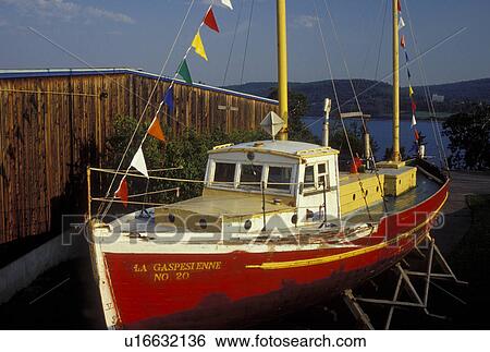 Gaspe Peninsula, Gaspe, Quebec, Canada, Gulf of St. Lawrence, Red sailing vessel displayed at the Gaspesie Museum (Musee de la Gaspesie) in Gaspe on the Gaspe Peninsula. View Large Photo Image Stock Photograph - Gaspe Peninsula, Gaspe, Quebec, Canada, Gulf of St. Lawrence, Red sailing vessel displayed at the Gaspesie Museum (Musee de la Gaspesie) in Gaspe on the Gaspe Peninsula.. Fotosearch