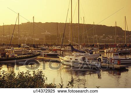 Stock Photography -  Gaspe Peninsula, Gaspe, Quebec, Canada, Gulf of St. Lawrence, Boats docked in a marina along the Gulf of St. Lawrence in Gaspe on the Gaspe Peninsula.. Fotosearch