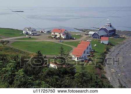Gaspe Peninsula, Petit Vallee, Quebec, Canada, Gulf of St. Lawrence, Scenic view of white cabins with red roofs in the village of Petit Vallee on the Gaspe Peninsula along the St. Lawrence River in Quebec. View Large Photo Image Stock Image - Gaspe Peninsula, Petit Vallee, Quebec, Canada, Gulf of St. Lawrence, Scenic view of white cabins with red roofs in the village of Petit Vallee on the Gaspe Peninsula along the St. Lawrence River in Quebec.. Fotosearch