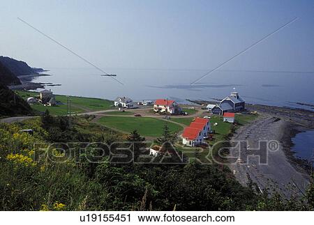 Gaspe Peninsula, Petit Vallee, Quebec, Canada, Gulf of St. Lawrence, Scenic view of white cabins with red roofs in the village of Petit Vallee on the Gaspe Peninsula along the St. Lawrence River in Quebec. View Large Photo Image Stock Image - Gaspe Peninsula, Petit Vallee, Quebec, Canada, Gulf of St. Lawrence, Scenic view of white cabins with red roofs in the village of Petit Vallee on the Gaspe Peninsula along the St. Lawrence River in Quebec.. Fotosearch