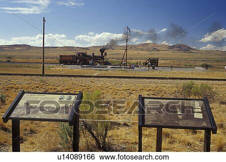 Stock Photograph -  Golden Spike National Historic Site, Utah, UT, Jupiter Train, Promontory Summit, the place where the Union Pacific and Central Pacific rails met to form the nation's first transcontinental railroad. Fotosearch