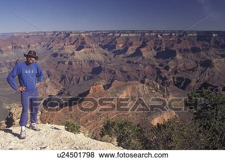 Stock Photo -  Grand Canyon National Park, AZ, Arizona, South Rim, Man standing above canyon. Fotosearch