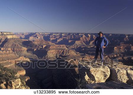 Grand Canyon National Park, AZ, Arizona, South Rim, Man standing above canyon View Large Photo Image Stock Photography - Grand Canyon National Park, AZ, Arizona, South Rim, Man standing above canyon. Fotosearch