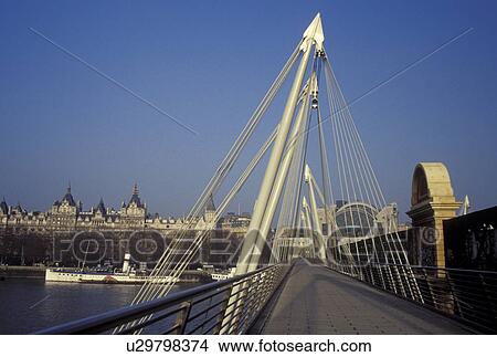 Picture -  Great Britain, London, England, United Kingdom, Europe, Hungerford Foot Bridge crosses the River Thames. . Fotosearch