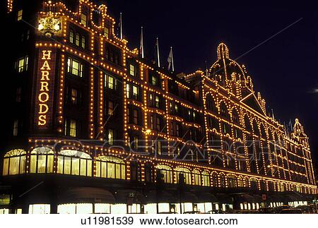 Stock Photo -  Harrods, London, England, Great Britain, United Kingdom, Europe, Harrods Department Store illuminated at night in downtown London.. Fotosearch
