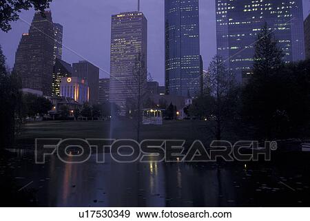 Stock Photo -  Houston, TX, Texas, Skyline of downtown Houston from Sam Houston Historical Park, evening. Fotosearch