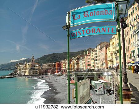 Stock Image -  Italy, Liguria, Camogli, Riviera di Levante, Ligurian Riviera, Europe, The beach along the waterfront of the resort town of Camogli along the Ligurian Sea.. Fotosearch