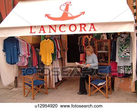 Stock Image -  Italy, Portofino, Liguria, Riviera di Levante, Ligurian Riviera, Europe, Clothes boutique along the waterfront in the resort town of Portofino along the Ligurian Sea.. Fotosearch