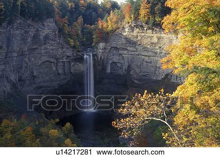 Stock Image -  Ithaca, NY, New York, Finger Lakes Region, Taughannock Falls State Park, 215 foot waterfall, autumn. Fotosearch