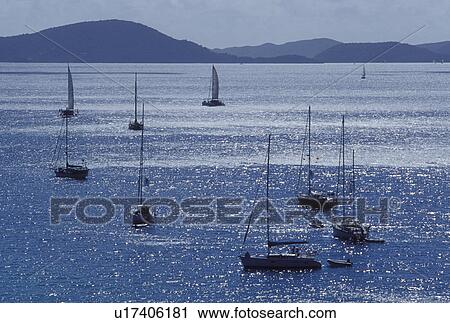 Jost Van Dyke, British Virgin Islands, Caribbean, BVI, Boats anchored in Great Harbor on Jost Van Dyke Island on the Caribbean Sea. View Large Photo Image Stock Image - Jost Van Dyke, British Virgin Islands, Caribbean, BVI, Boats anchored in Great Harbor on Jost Van Dyke Island on the Caribbean Sea.. Fotosearch