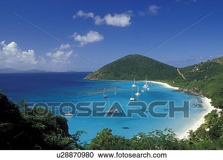 Jost Van Dyke, British Virgin Islands, Caribbean, BVI, Scenic view of the beach and boats anchored in White Bay on Jost Van Dyke Island on the Caribbean Sea. View Large Photo Image Stock Image - Jost Van Dyke, British Virgin Islands, Caribbean, BVI, Scenic view of the beach and boats anchored in White Bay on Jost Van Dyke Island on the Caribbean Sea.. Fotosearch