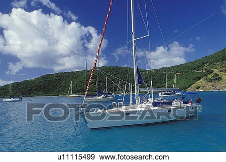 Jost Van Dyke, British Virgin Islands, Caribbean, BVI, Sailboats anchored in Great Harbor off of Jost Van Dyke Island on the Caribbean Sea. View Large Photo Image Stock Photo - Jost Van Dyke, British Virgin Islands, Caribbean, BVI, Sailboats anchored in Great Harbor off of Jost Van Dyke Island on the Caribbean Sea.. Fotosearch