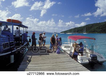 Jost Van Dyke, British Virgin Islands, Caribbean, BVI, People getting off the passenger ferry at the ferry dock terminal at Jost Van Dyke Island on Great Harbor on the Caribbean Sea. View Large Photo Image Stock Photograph - Jost Van Dyke, British Virgin Islands, Caribbean, BVI, People getting off the passenger ferry at the ferry dock terminal at Jost Van Dyke Island on Great Harbor on the Caribbean Sea.. Fotosearch