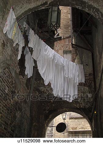 laundry, Tuscany, Italy, Siena, Toscana, Europe, Laundry hanging from a building in the city of Siena. View Large Photo Image Stock Photo - laundry, Tuscany, Italy, Siena, Toscana, Europe, Laundry hanging from a building in the city of Siena.. Fotosearch