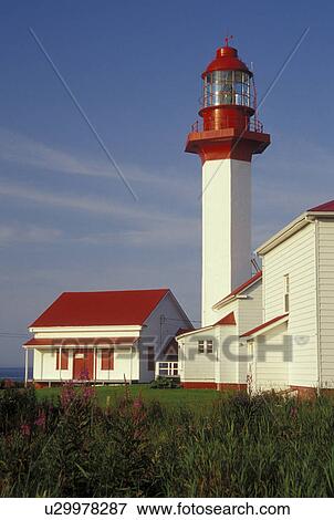 lighthouse, Gaspe Peninsula, Quebec, Metis-sur-Mer, Canada, Gulf of St. Lawrence, Pointe-de-Mitis Lighthouse with red roof in Metis-Sur-Mer along the St. Lawrence River on the Gaspe Peninsula in Quebec. View Large Photo Image Stock Photo - lighthouse, Gaspe Peninsula, Quebec, Metis-sur-Mer, Canada, Gulf of St. Lawrence, Pointe-de-Mitis Lighthouse with red roof in Metis-Sur-Mer along the St. Lawrence River on the Gaspe Peninsula in Quebec.. Fotosearch