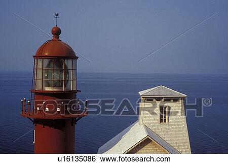 lighthouse, Gaspe Peninsula, Quebec, Pointe-a-la-Renommee, Canada, Gulf of St. Lawrence, The red Pointe-a-la-Renommee Lighthouse on the Gaspe Peninsula along the St. Lawrence River in Quebec. View Large Photo Image Stock Photograph - lighthouse, Gaspe Peninsula, Quebec, Pointe-a-la-Renommee, Canada, Gulf of St. Lawrence, The red Pointe-a-la-Renommee Lighthouse on the Gaspe Peninsula along the St. Lawrence River in Quebec.. Fotosearch