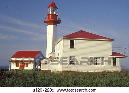 lighthouse, Gaspe Peninsula, Quebec, Metis-sur-Mer, Canada, Gulf of St. Lawrence, Pointe-de-Mitis Lighthouse with red roof in Metis-Sur-Mer along the St. Lawrence River on the Gaspe Peninsula in Quebec. View Large Photo Image Stock Photography - lighthouse, Gaspe Peninsula, Quebec, Metis-sur-Mer, Canada, Gulf of St. Lawrence, Pointe-de-Mitis Lighthouse with red roof in Metis-Sur-Mer along the St. Lawrence River on the Gaspe Peninsula in Quebec.. Fotosearch