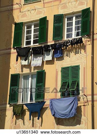 Liguria, Italy, Camogli, Riviera di Levante, Ligurian Riviera, Europe, Building with laundry hanging to dry along the waterfront of the resort town of Camogli along the Ligurian Sea. View Large Photo Image Stock Image - Liguria, Italy, Camogli, Riviera di Levante, Ligurian Riviera, Europe, Building with laundry hanging to dry along the waterfront of the resort town of Camogli along the Ligurian Sea.. Fotosearch